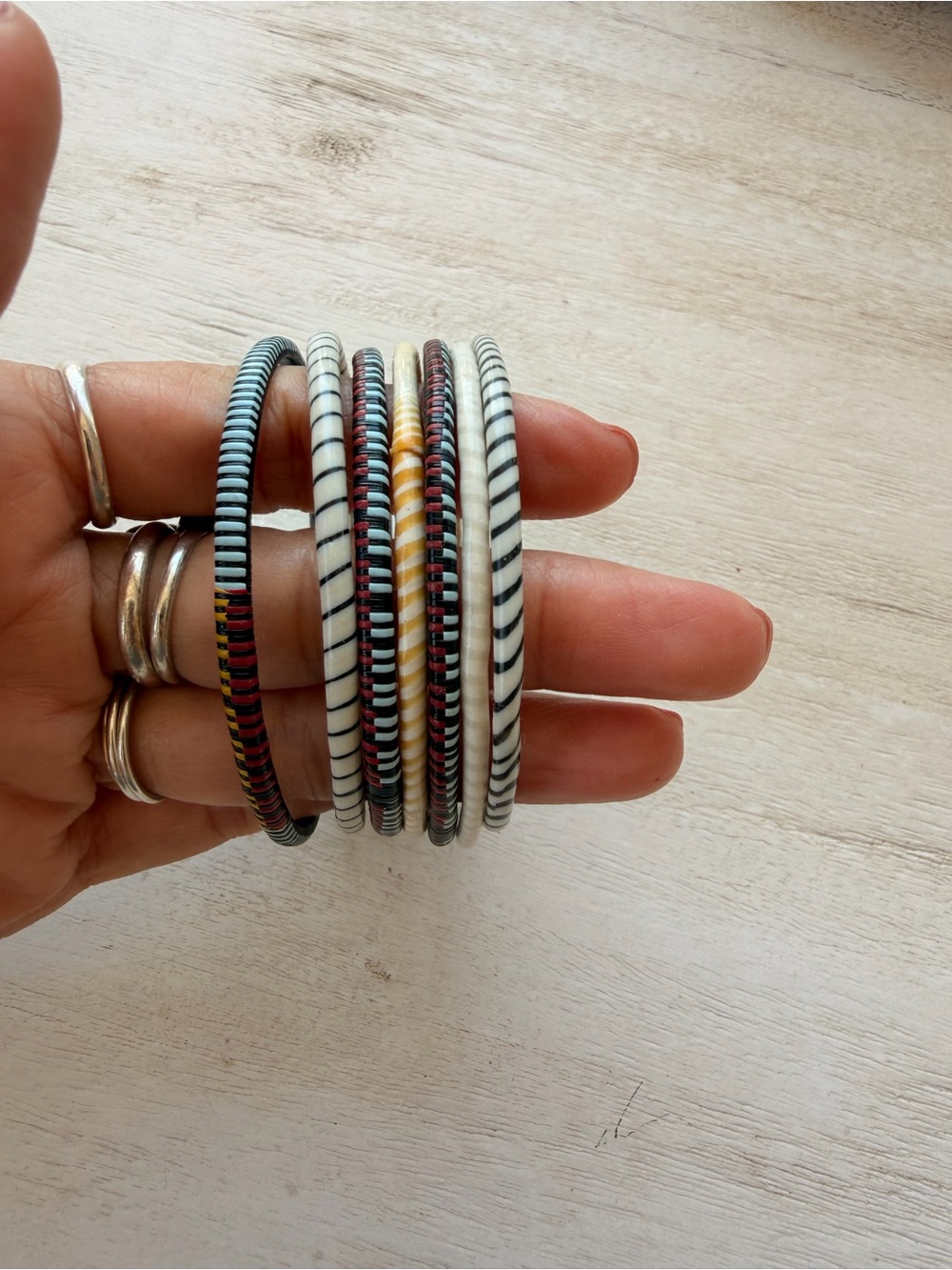 Stack of Black and White Striped Women’s Bangles from recycle plastic and wire